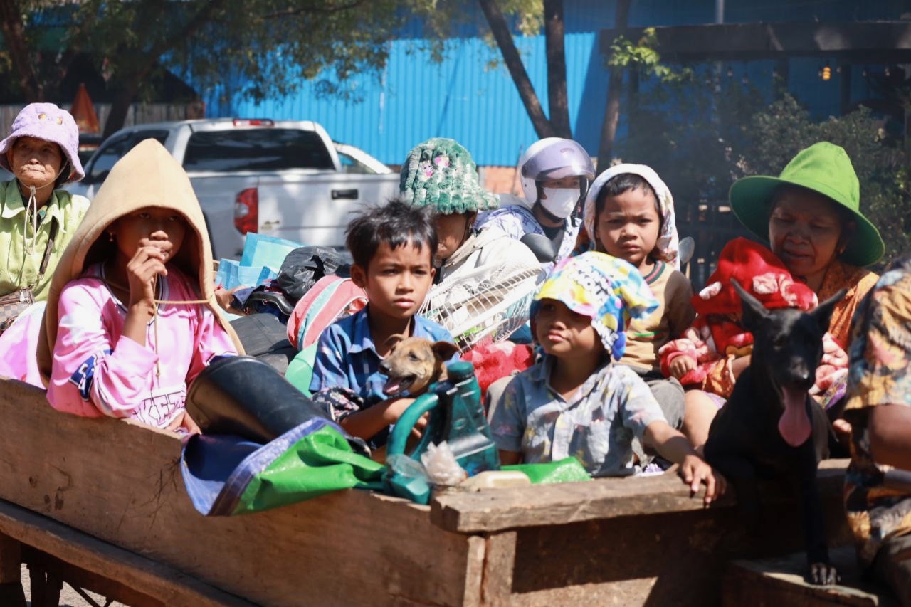 Family travelling by cart