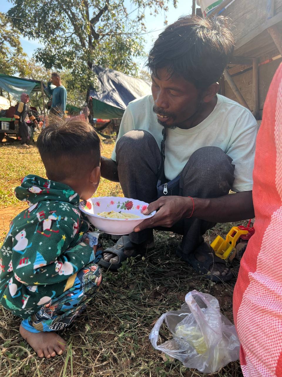 A father feeding his child